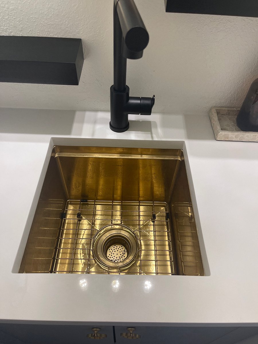 Bar sink deep enough to clean dishes. No garbage disposal.