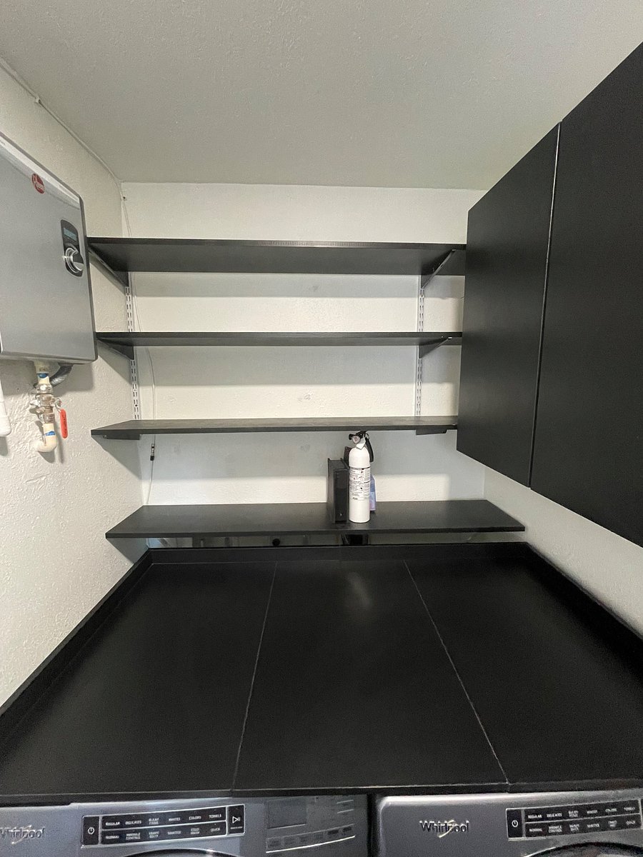 Laundry room, shared and can store supplies on the shelves.