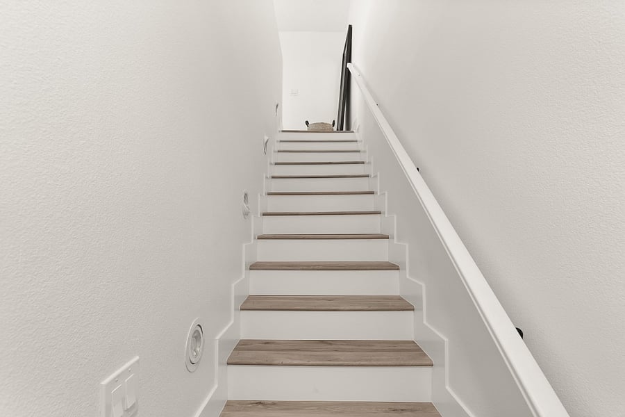 Stairway entrance with storage closet at bottom left.