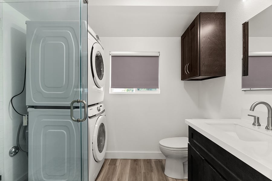 bathroom with washer and dryer.