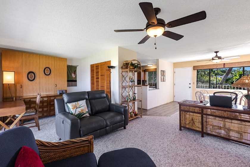 Living room/bonus space with Murphy bed (left).