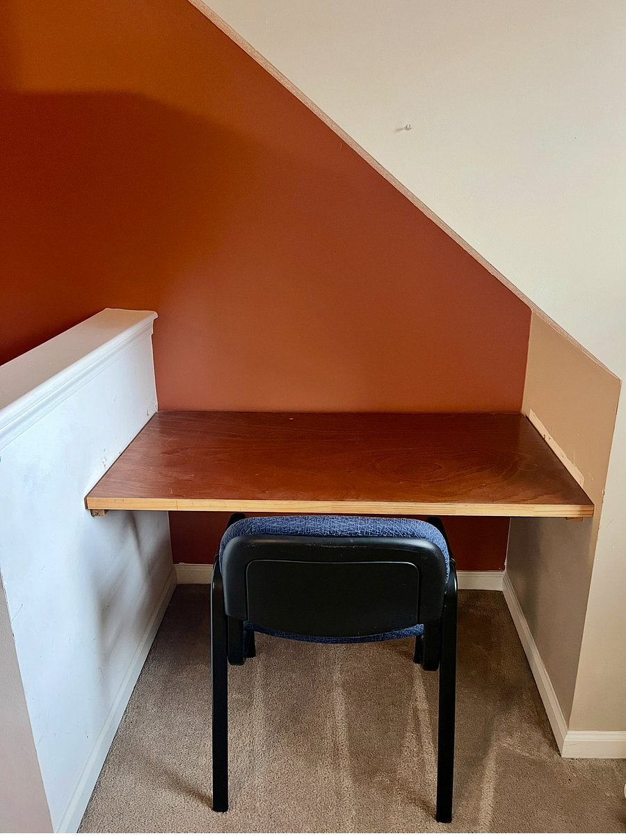 Loft has a desk area with a printer.