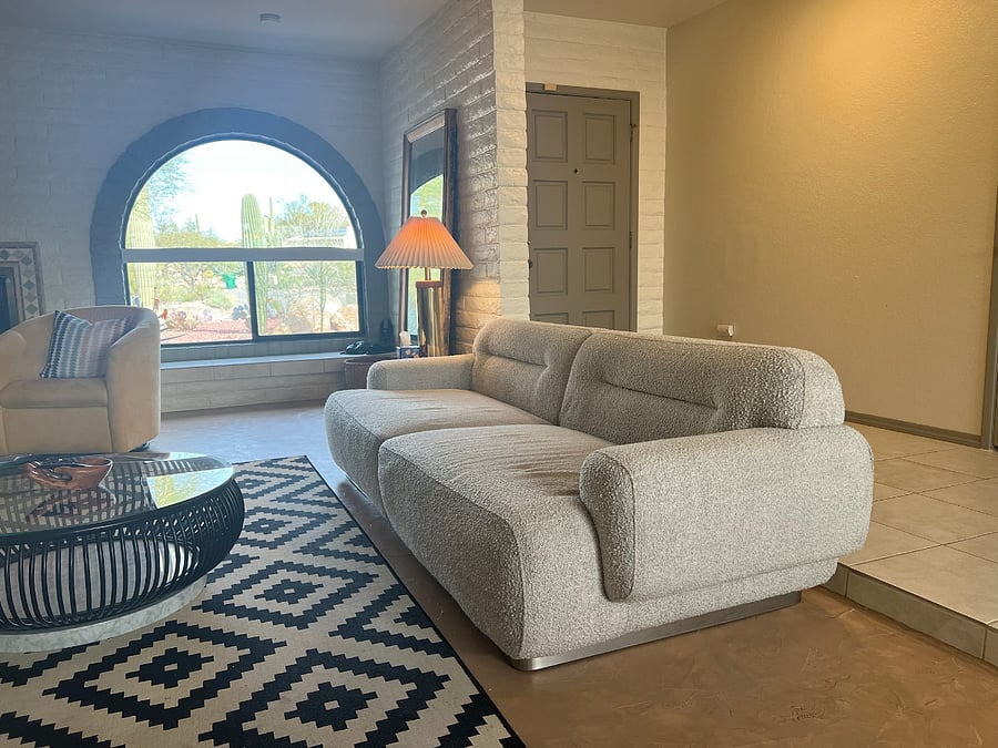 Entry + Sunken Living Room with wood-burning fireplace
