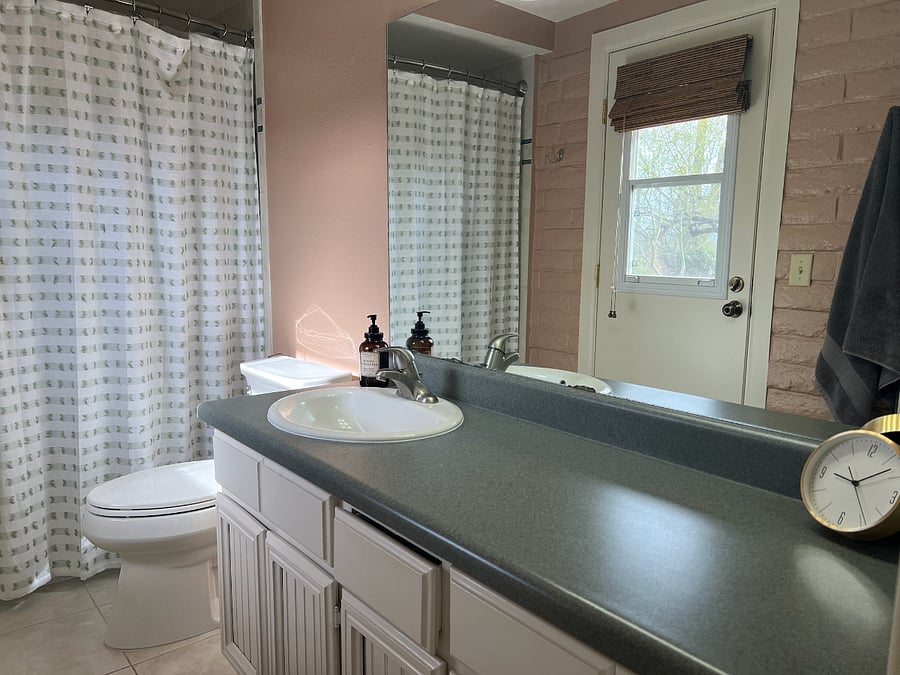 Primary Bathroom ensuite with direct access to yard