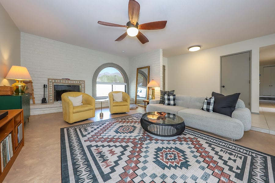Living room area with swivel chairs to take in the fireplace or the views through the picture window