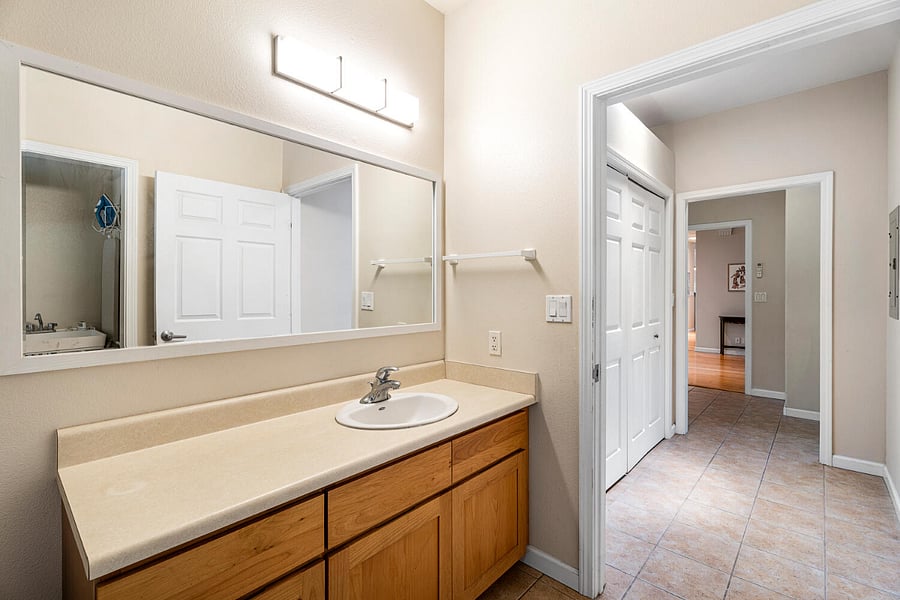 Bathroom #2 features a wide vanity