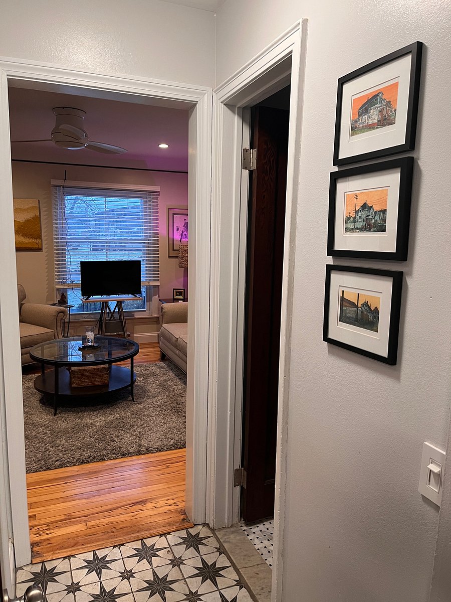 Hallway between living room and kitchen with a 1/2 bath.