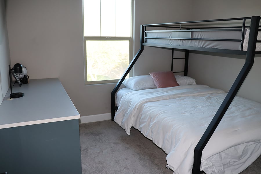 Bedroom 3, bunk bed with twin xl over queen. Also with dedicated office desk/drawers.