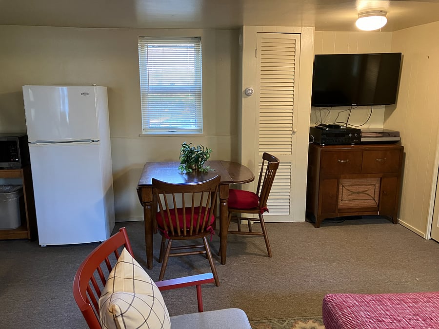 Dining area, smart TV, and record player.