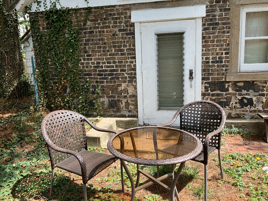 There is a small, private backyard behind the tiny house.