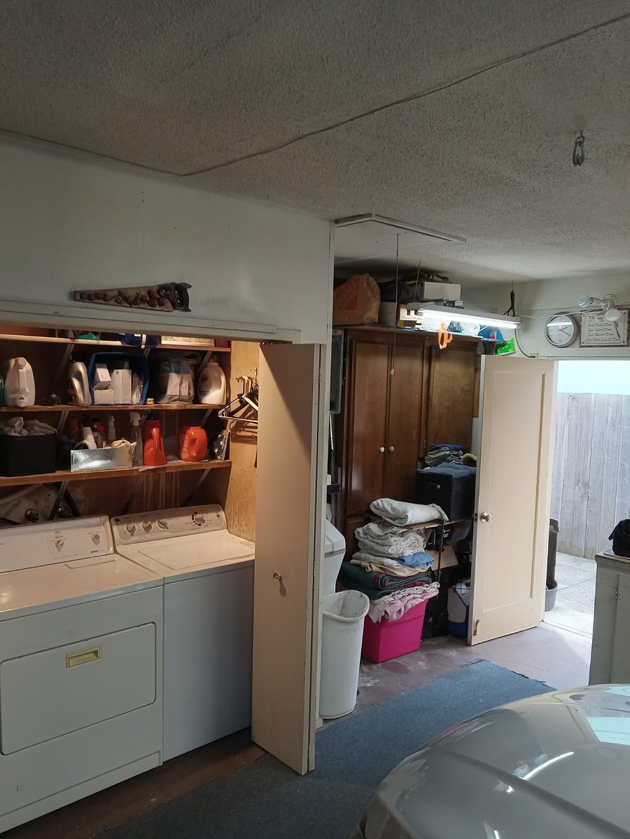 Washer and dryer located in clean garage