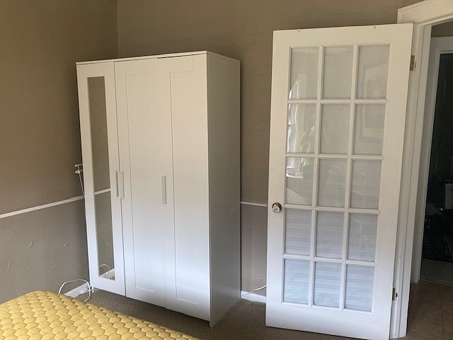 Second bedroom with wardrobe.