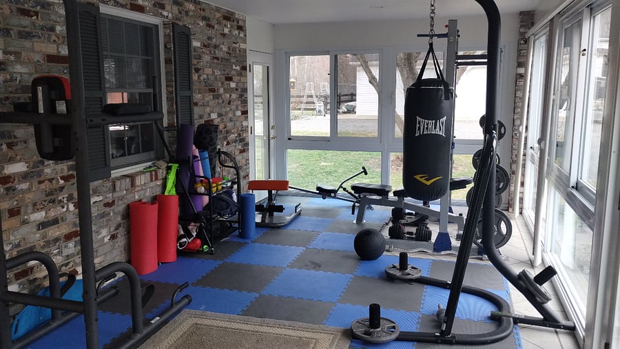 Workout space in the sunroom on the west side of the house next to the parking.