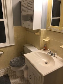 Large shared bathroom with plenty of storage for your toiletries.