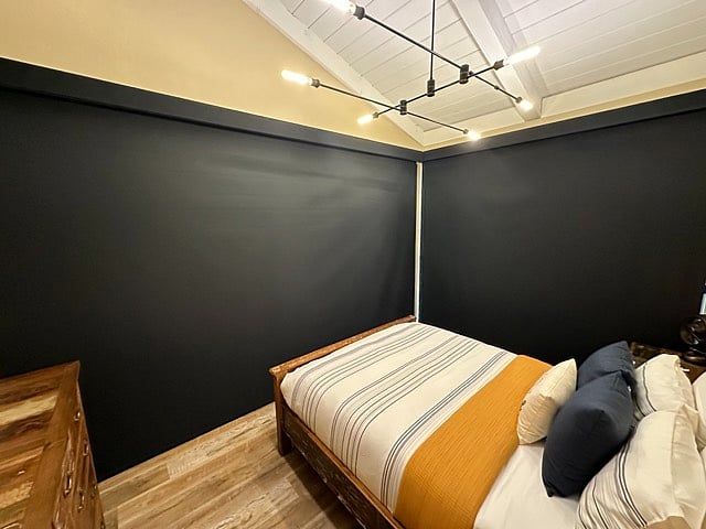 Bedroom with custom shades closed for privacy.