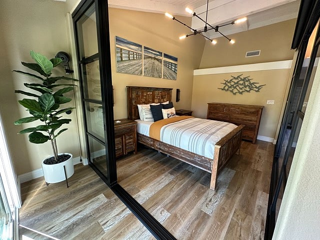 Reclaimed teak bedroom furniture with 2 large nightstands and 9-drawer dresser. 17 foot ceilings