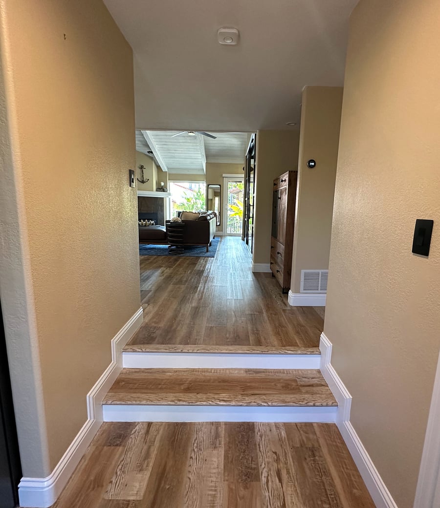 Entryway: kitchen to the left, hall closet on the right, then the bathroom on the right.
