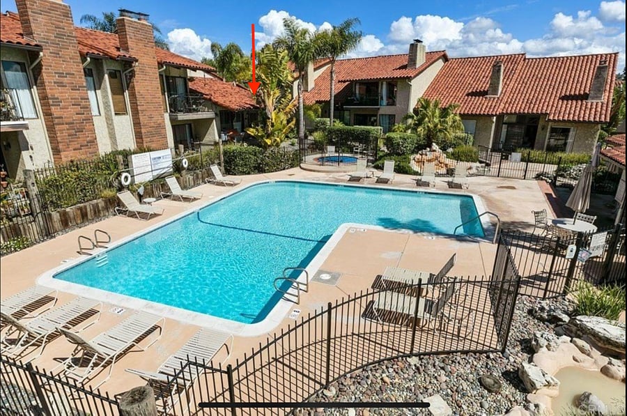 View from neighbors patio across the way. Red arrow shows the unit.