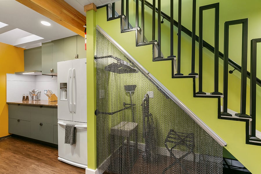 Hidden under stairs closet with rods and more