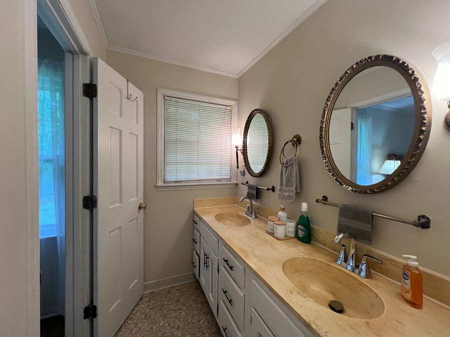 Bedroom 1- Private double-sink bathroom off primary suite with shower