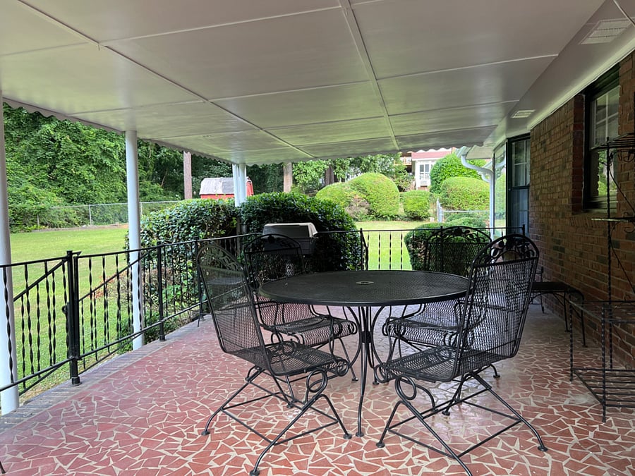 Access the deck/ patio space from the den/family room to entertain or to get away and enjoy nature.