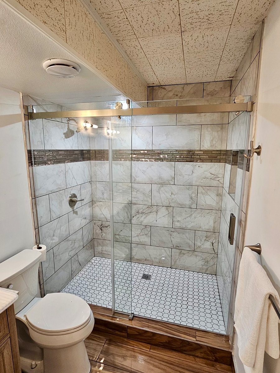Start and end your day in this spa like bathroom! 5 double sinks w/stone top, drawer storage wood vanity, 6x 3.5shower, comfort height toilet 