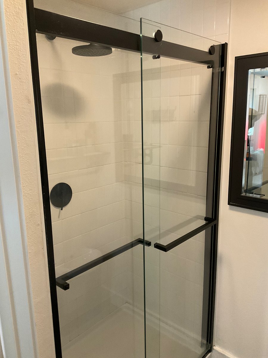 Walk-in shower. The toilet is in a separate room.