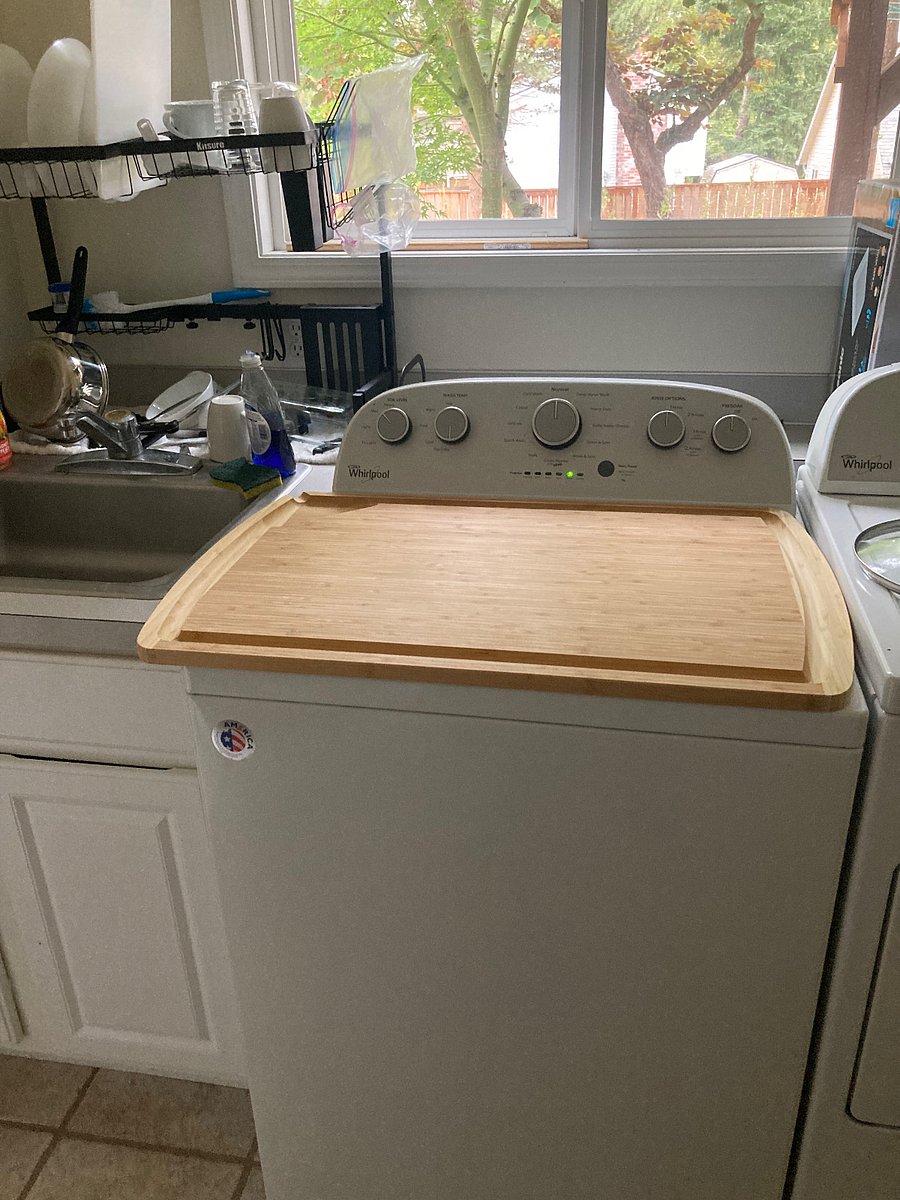 The latest addition to the kitchenette, this huge bamboo cutting board over the washing machine provides additional counter space. 
