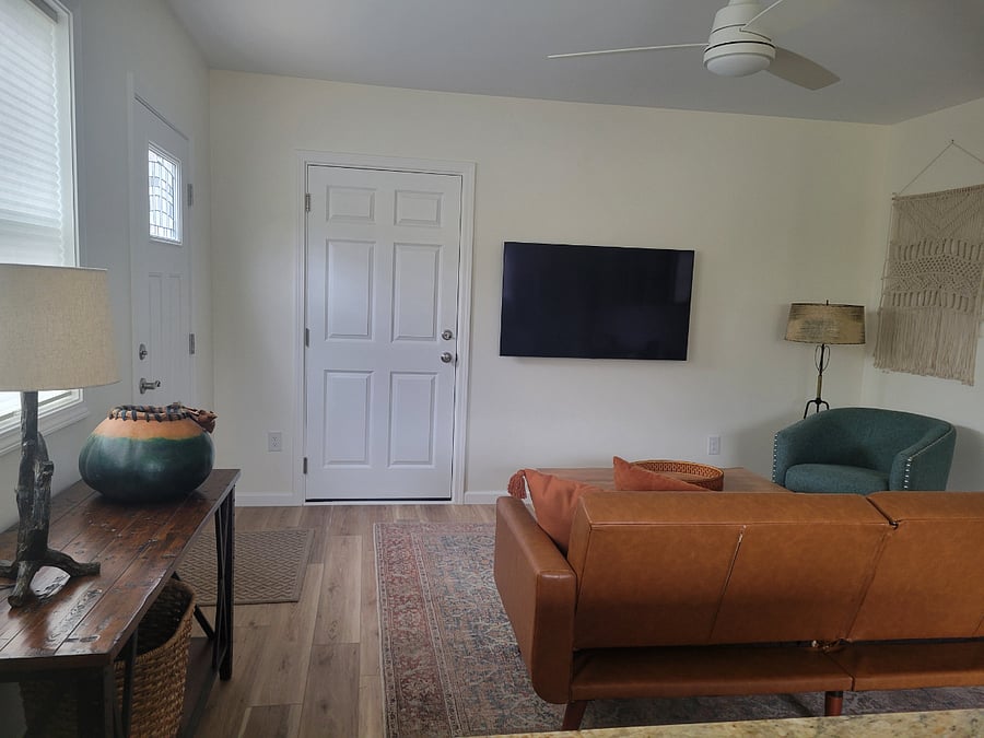 Living room with smart TV and garage access