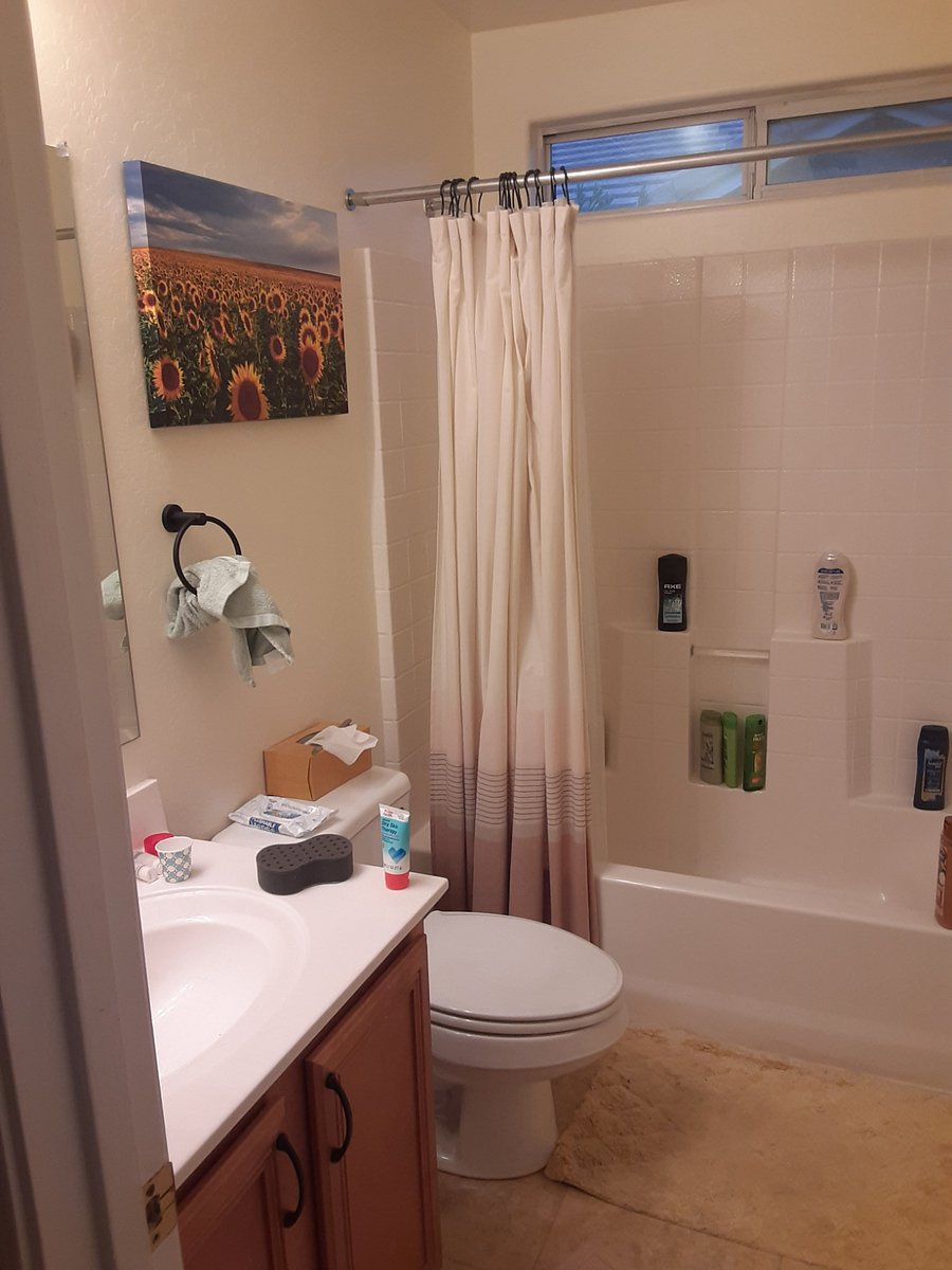 Full bathroom between the 2 bathrooms. Linen closet is opposite this bathroom.