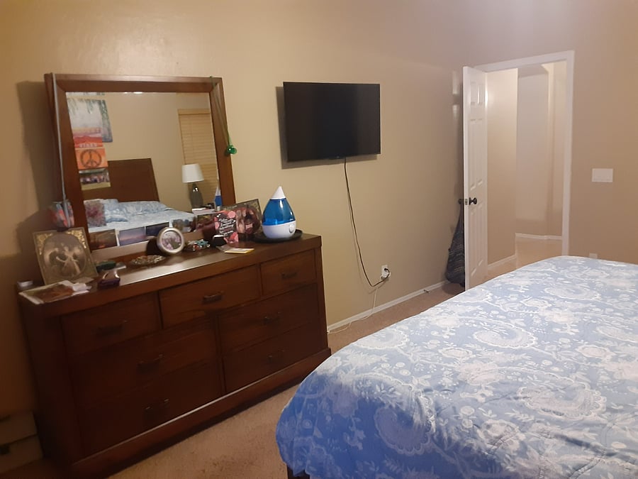 dresser, mirror and smart TV