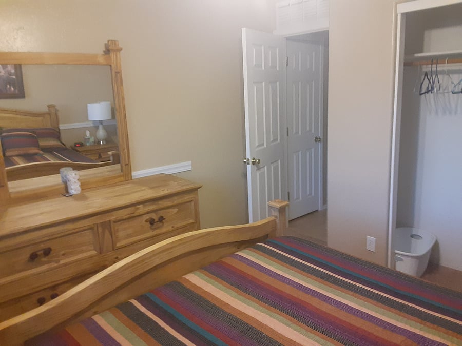 Again the bedroom on the right, this picture shows the dresser with a mirror and the full closet on the right of the picture.