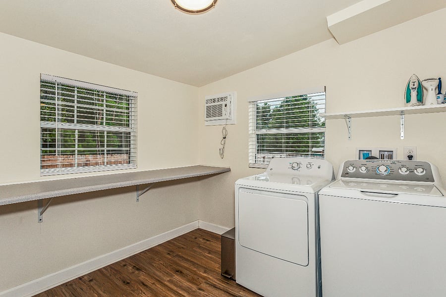 oversize laundry room with full size washer and dryer