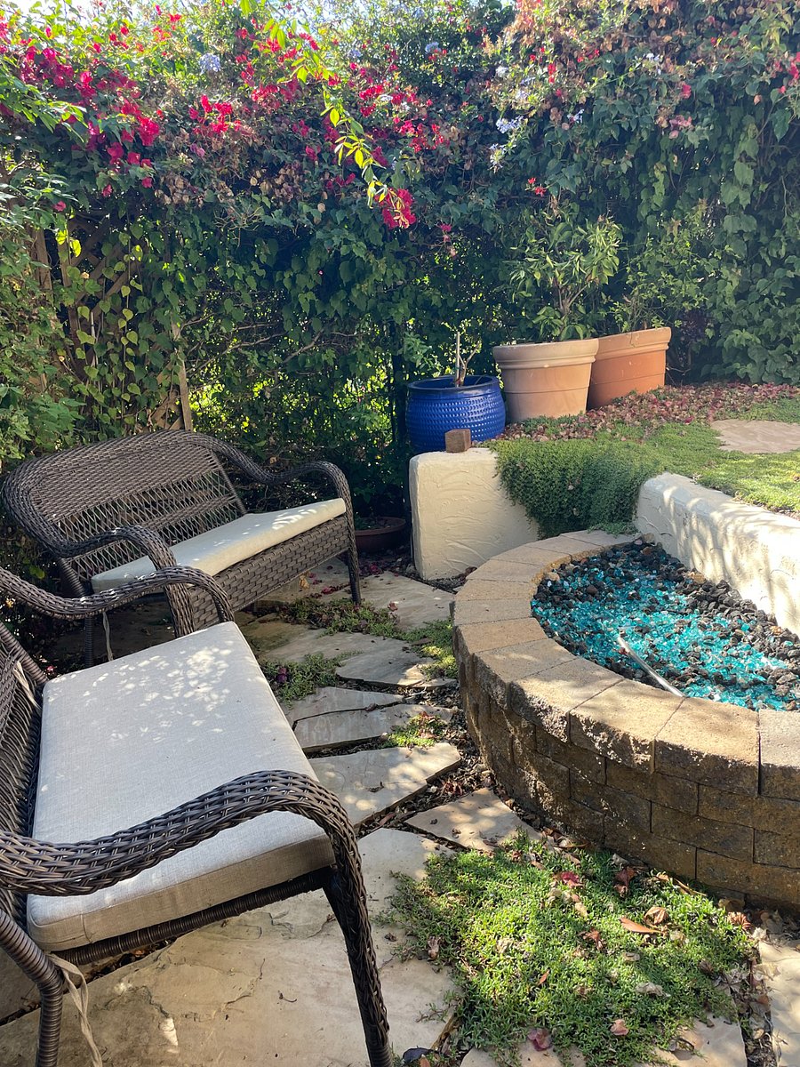 Shared backyard with firepit and seating area.