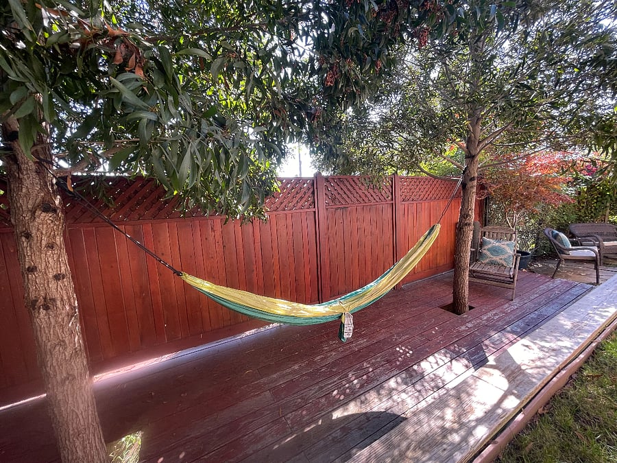 Shared back deck with shaded hammock. Great place to read a book or take a nap.