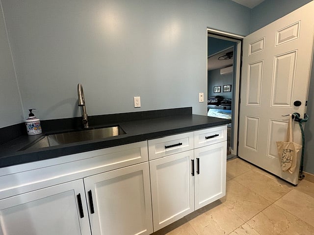 Laundry room utility sink and counter.