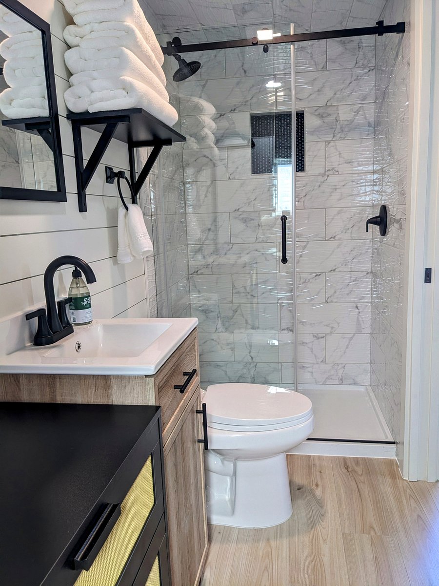 Tiled shower with 3 function shower head and sliding door