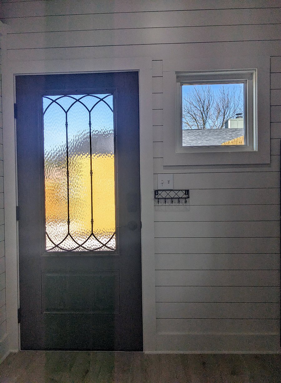 Front door and window provide lots of natural light