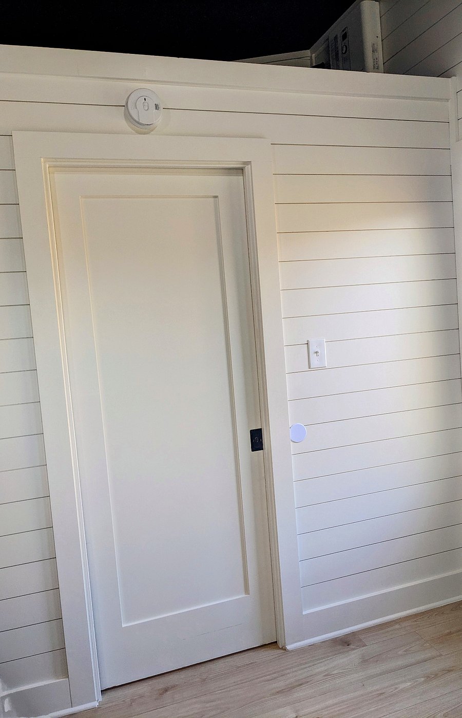Barn door between the kitchen / bedroom area and the bathroom / laundry area provides privacy