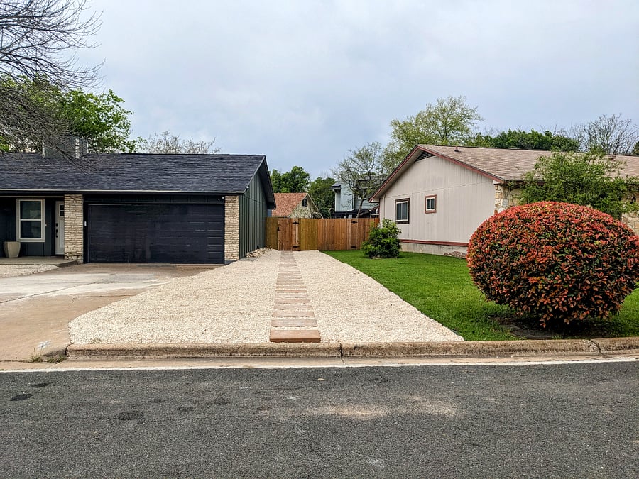 On street parking with pathway to tiny house entrance. The main house is a separate rented space on the property we own.