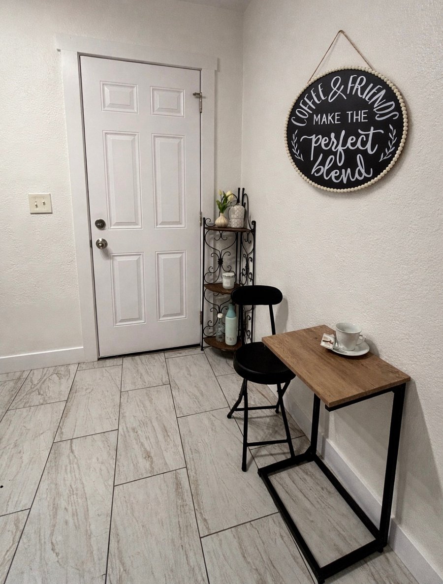 Small seating area - this is a side door exit via the kitchen.