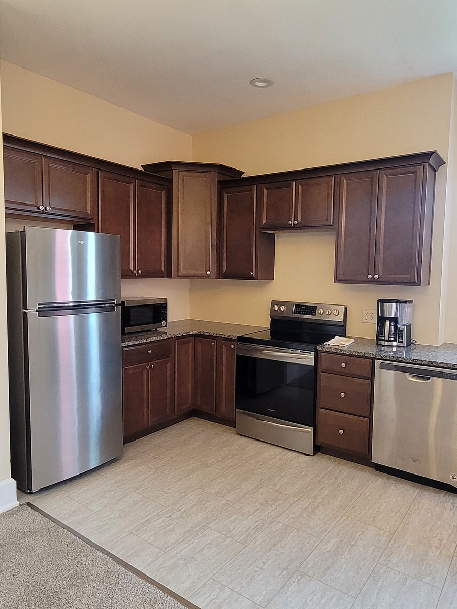 Coffee maker, microwave, dishes, utensils, and pots and pans