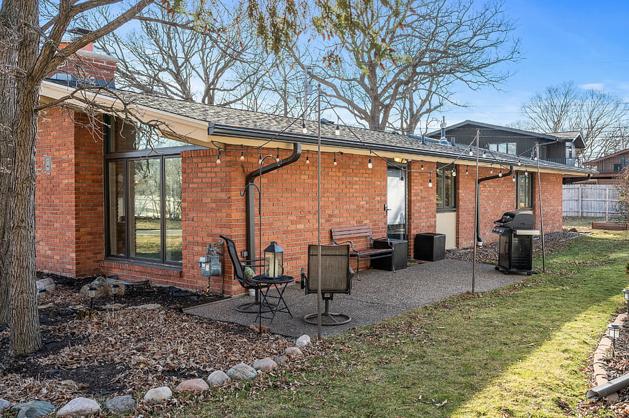 Side patio off kitchen with BBQ grill for your use.