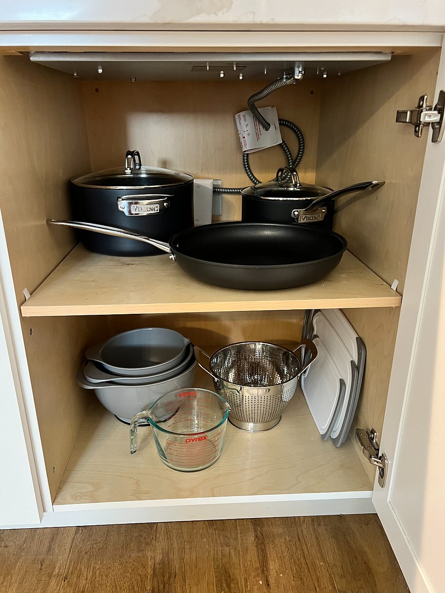 Pots and pans, strainer, cutting boards, and measuring cups