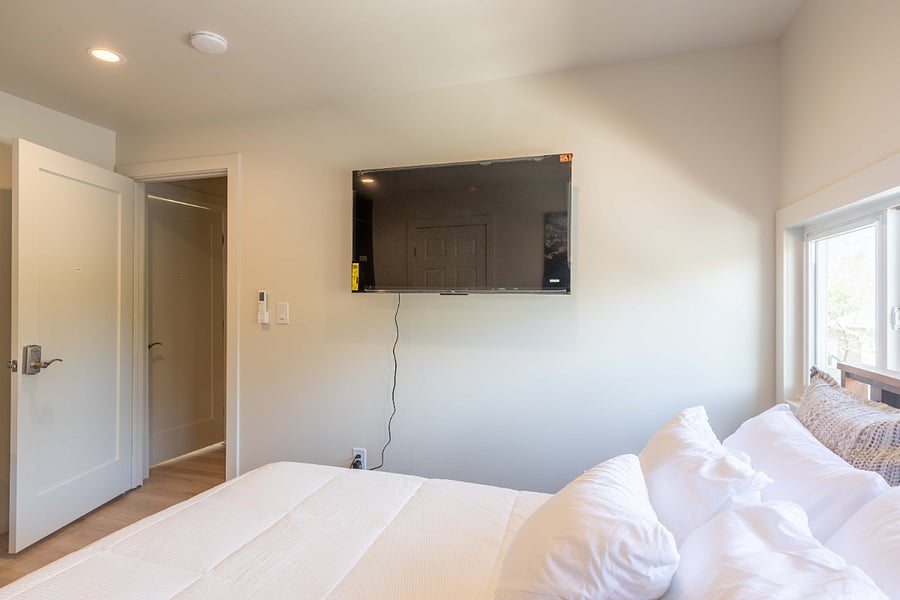 50" Smart TV and small fridge in the room