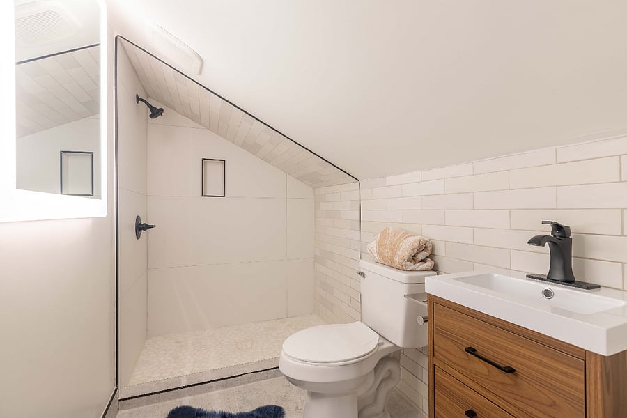Private ensuite bathroom. Porcelain Tiles. Large Backlit Mirror