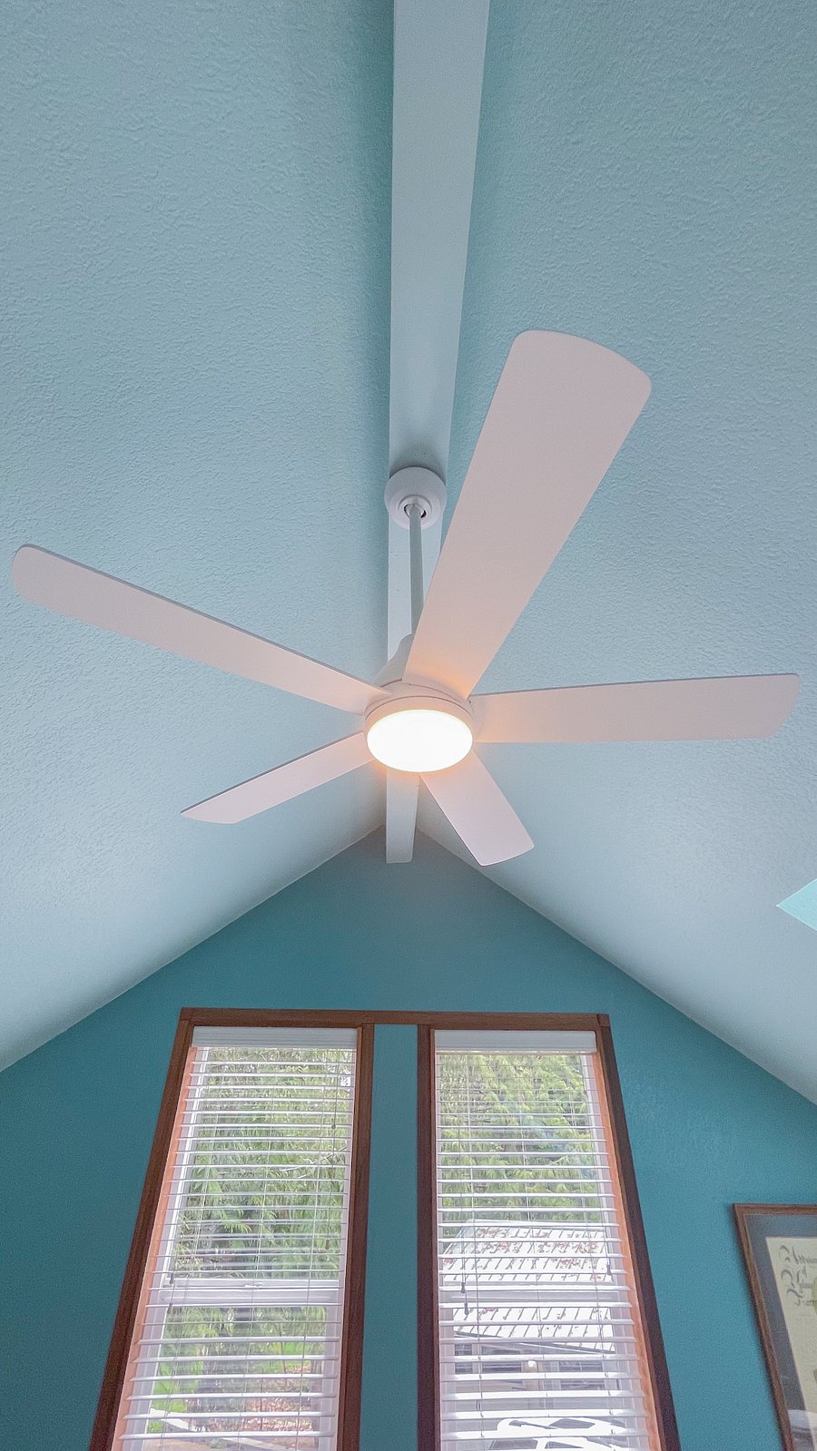 Vaulted ceilings with fan.