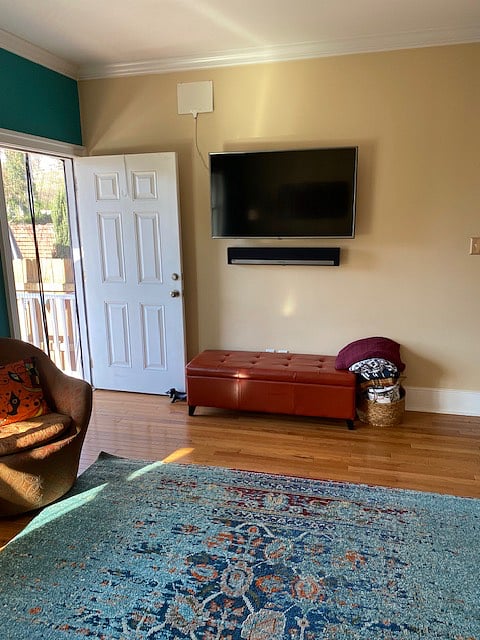 Smart tv in living room and back door to deck.