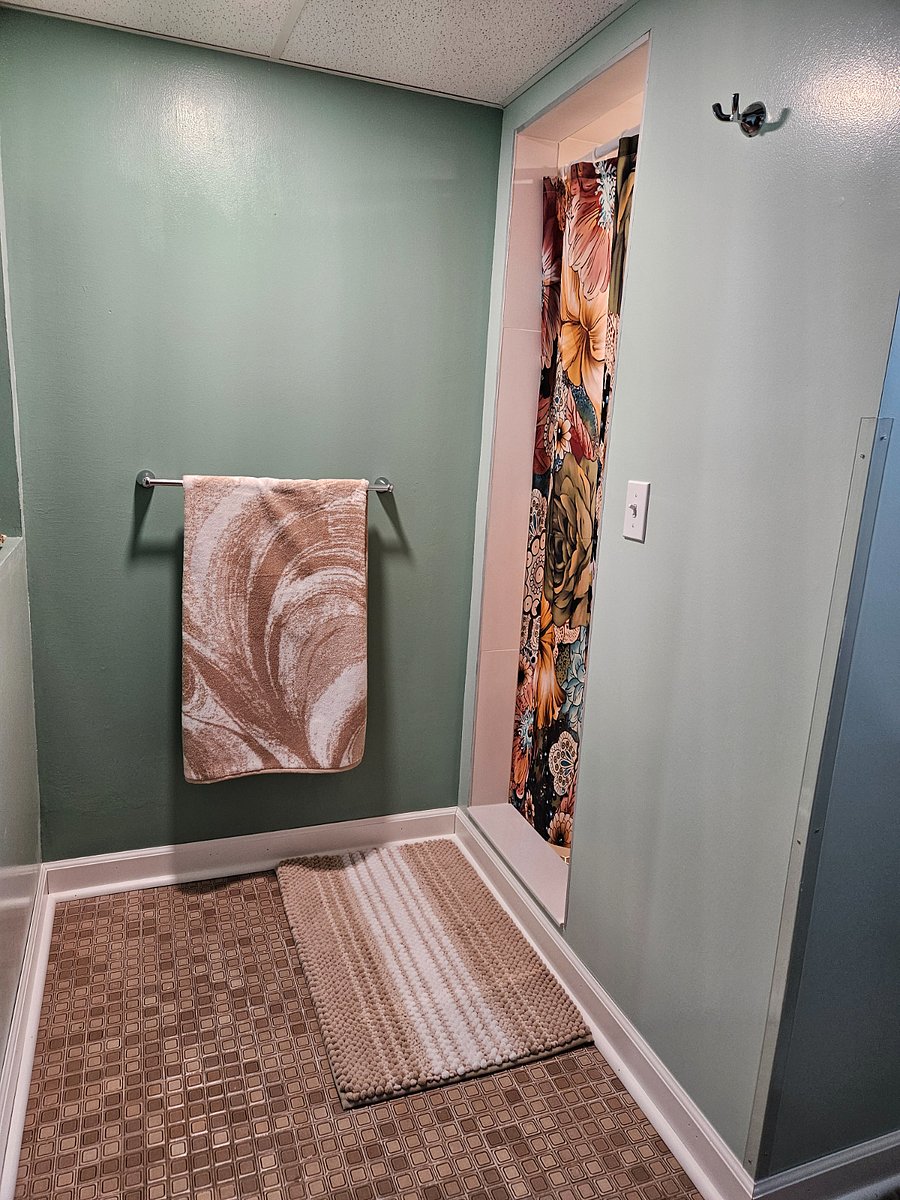 Large space in front of shower.