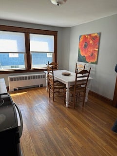 View of the kitchen dining table. Seats 4 people but has room for more.....(2 folding chars)